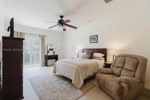 a spacious bedroom with a bed and a couch