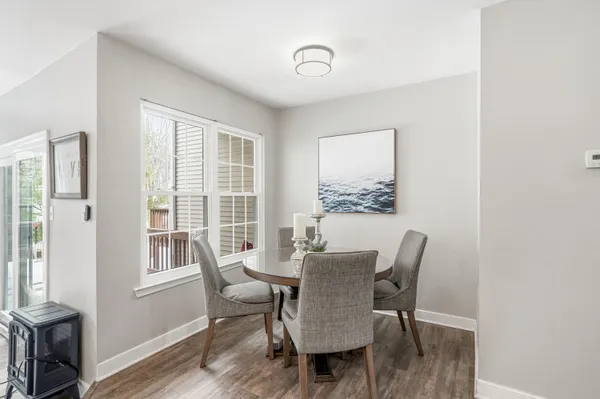 a view of a dining room with furniture window and wooden floor