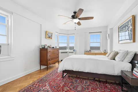 a bed room with a bed and a window
