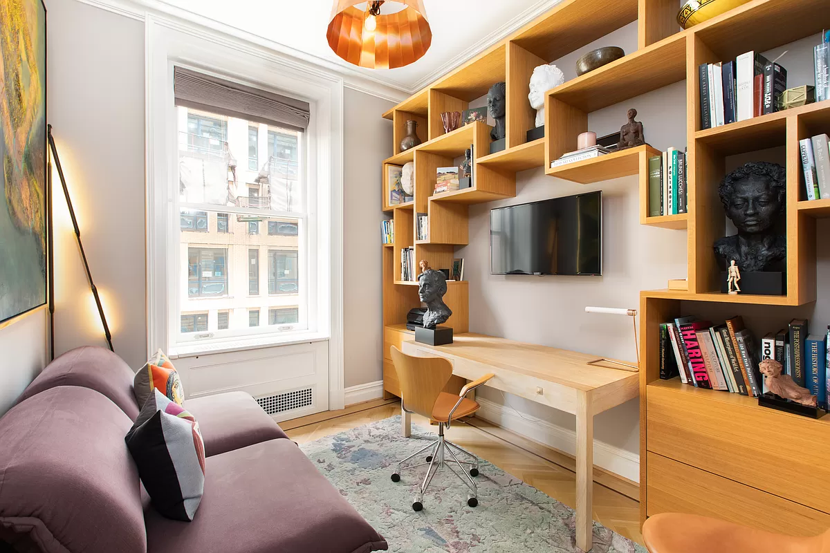 390 West End Avenue, Unit 7DS Manhattan, NY 10024 - Photo 12 of 31 a living room with fireplace furniture and a book shelf