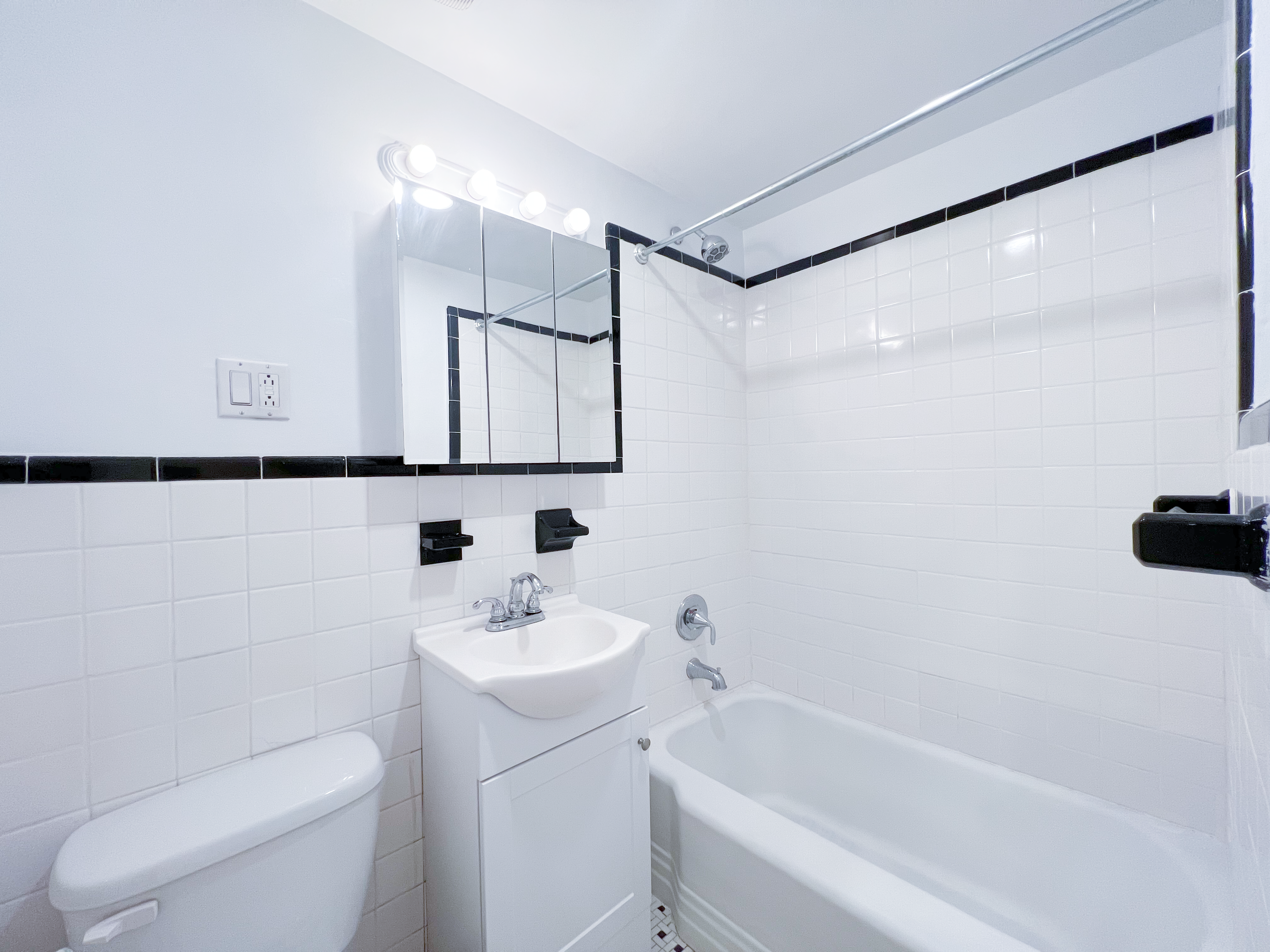 651 10th Street, Unit 1 Brooklyn, NY 11215 - Photo 9 of 12 a bathroom with a sink toilet and shower