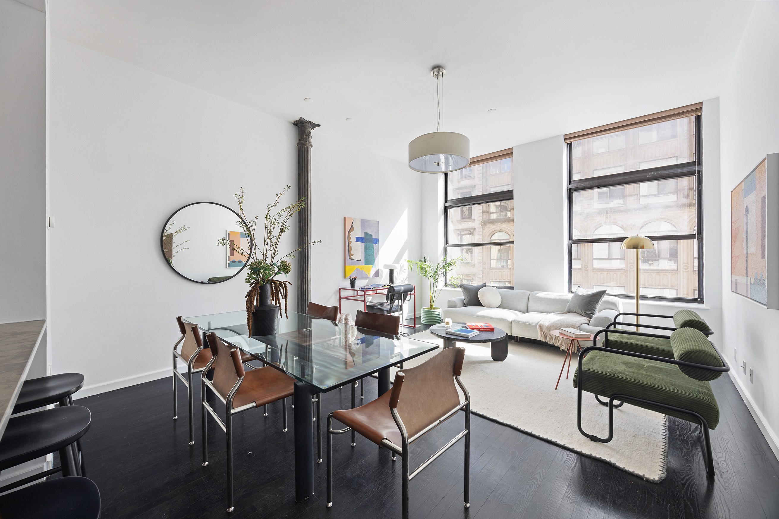 100 Reade Street, Unit 3C Manhattan, NY 10013 - Photo 3 of 9 a living room with furniture a window and a chandelier