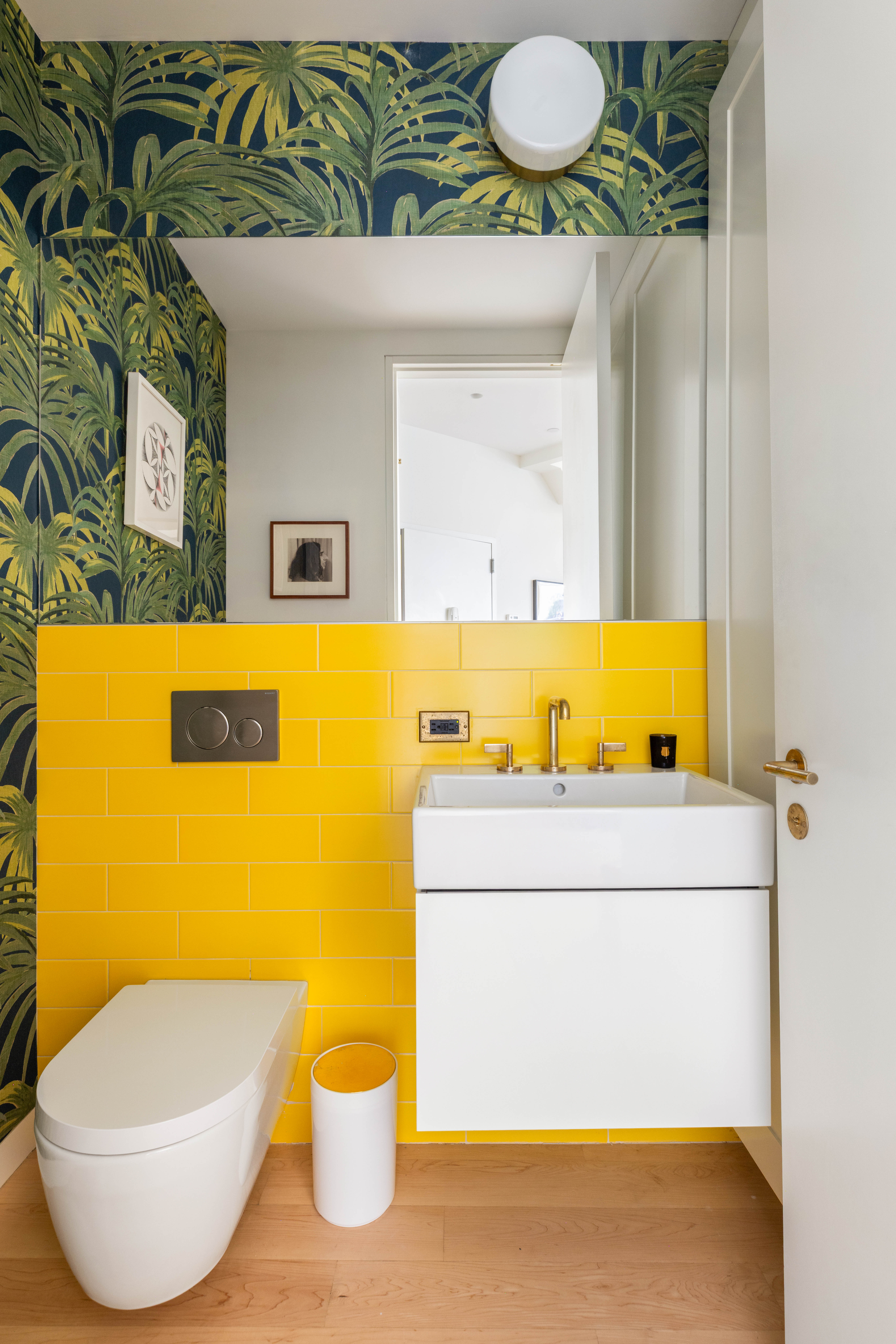 130 Jane Street, Unit 5/6F Manhattan, NY 10014 - Photo 20 of 23 a bathroom with a granite countertop sink and a mirror