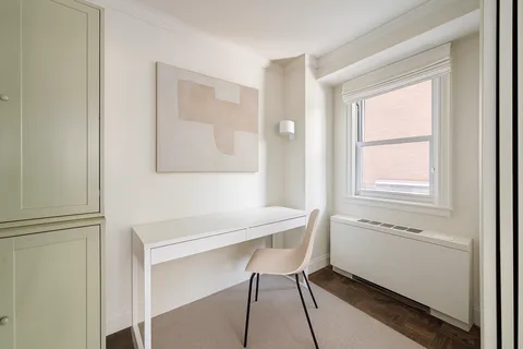 a bathroom with a sink a mirror and a window