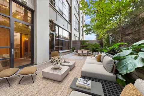 a outdoor space with patio the couches and a potted plant on a table