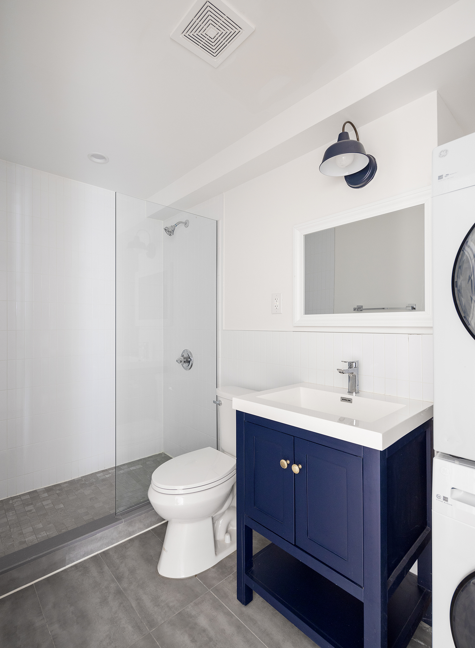 59 Irving Place, Unit 1 Brooklyn, NY 11238 - Photo 4 of 6 a bathroom with a toilet a sink and mirror