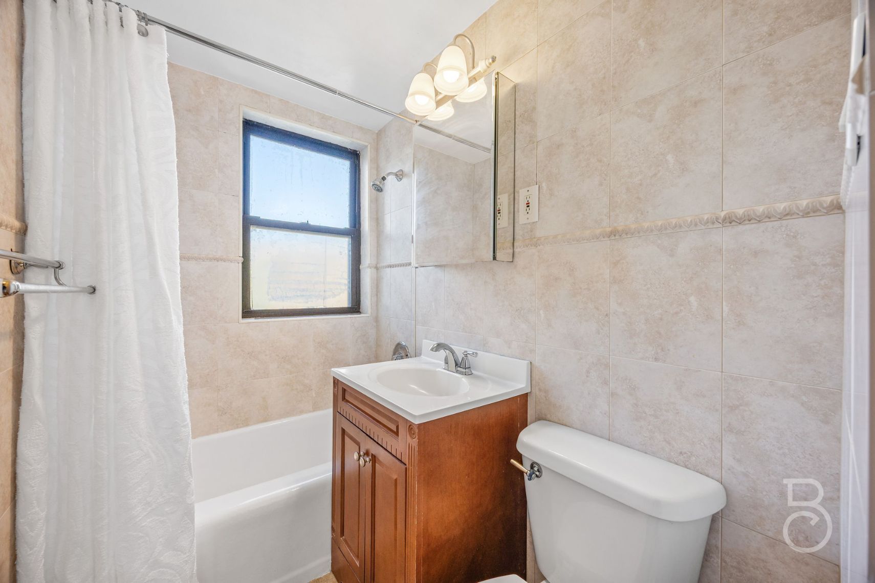 99-52 66th Road, Unit 5D Queens, NY 11374 - Photo 7 of 13 a bathroom with a sink toilet and shower