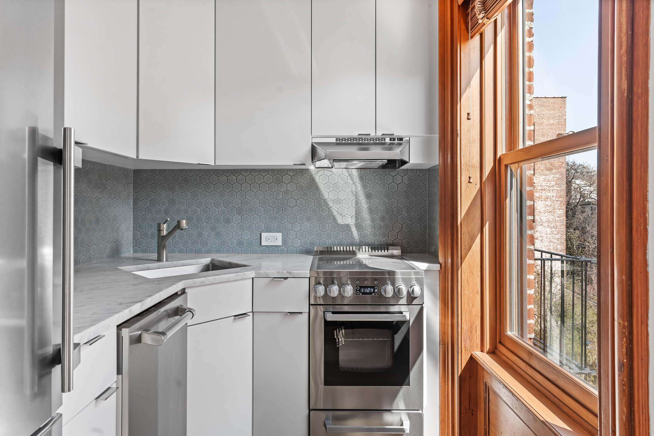 315 Adelphi Street, Unit 3 Brooklyn, NY 11205 - Photo 4 of 10 a kitchen with a stove top oven cabinetry