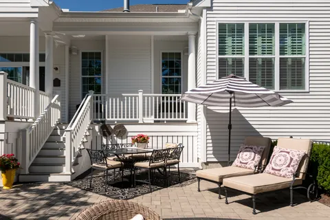 a view of a two chairs in the balcony