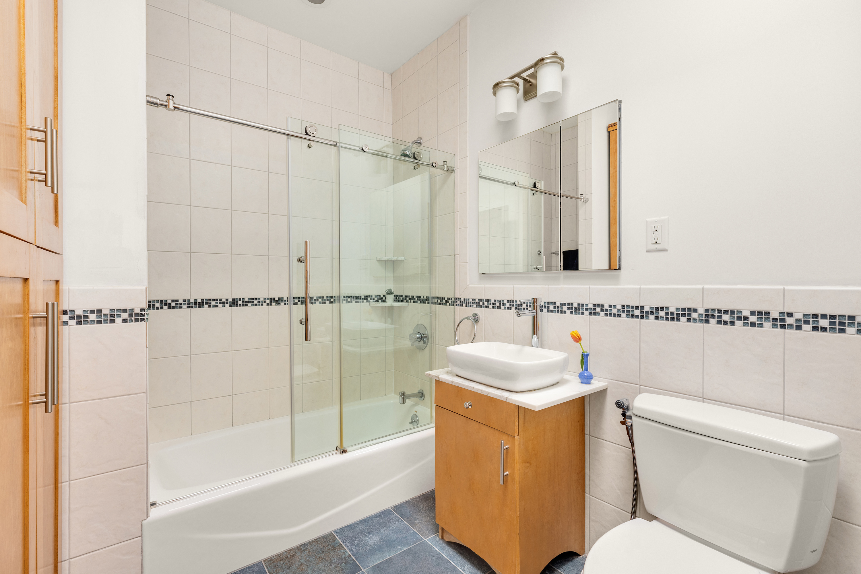 301 A 13th Street Brooklyn, NY 11215 - Photo 9 of 16 a bathroom with a sink toilet and shower