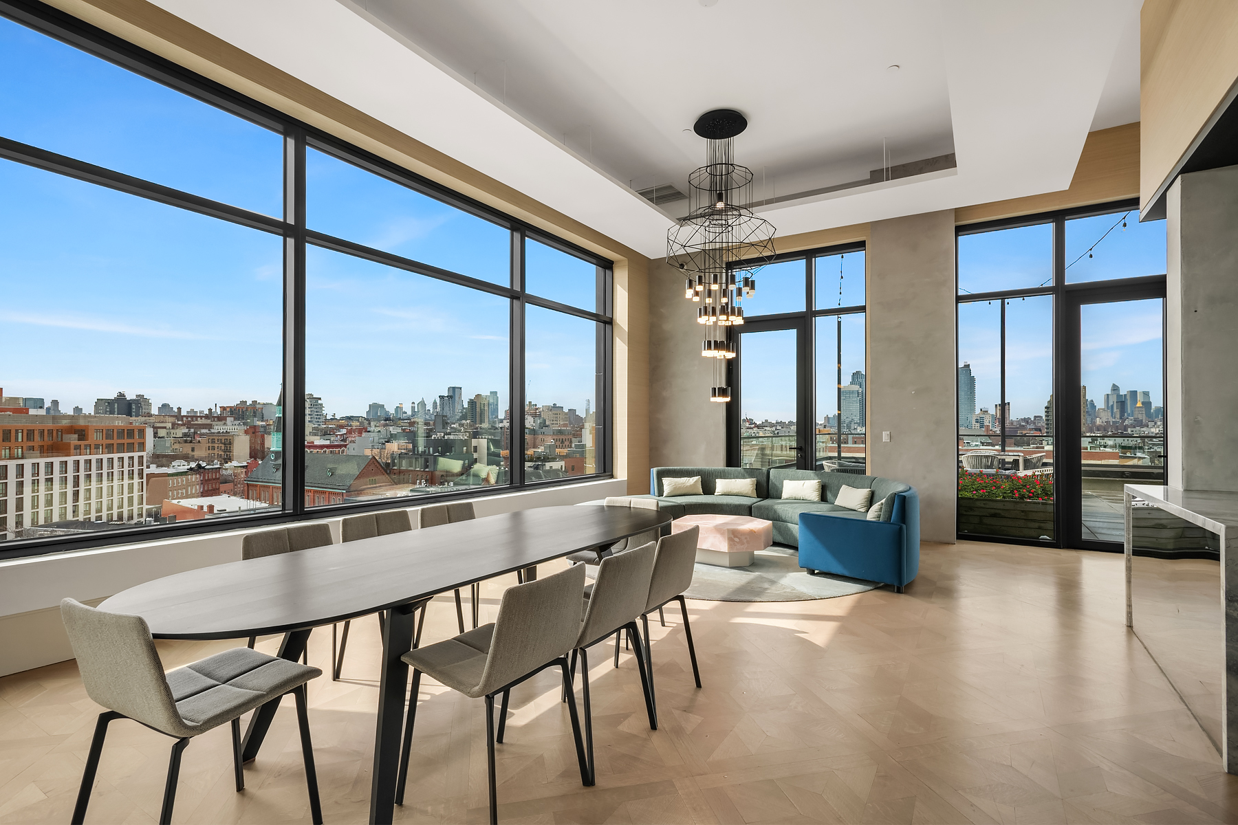 308 North 7th Street, Unit 7E Brooklyn, NY 11211 - Photo 9 of 13 a dining room with furniture a chandelier and wooden floor