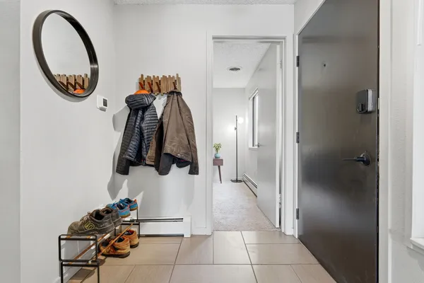 a bedroom with a bed and a dressers