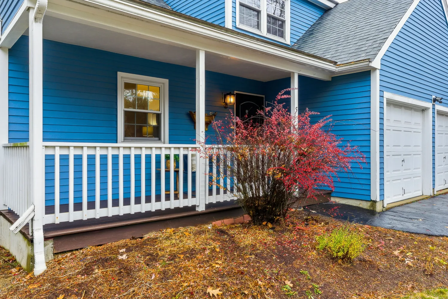 a view of a house with wooden fence