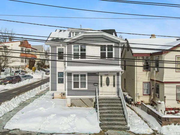 a front view of a house with a large window