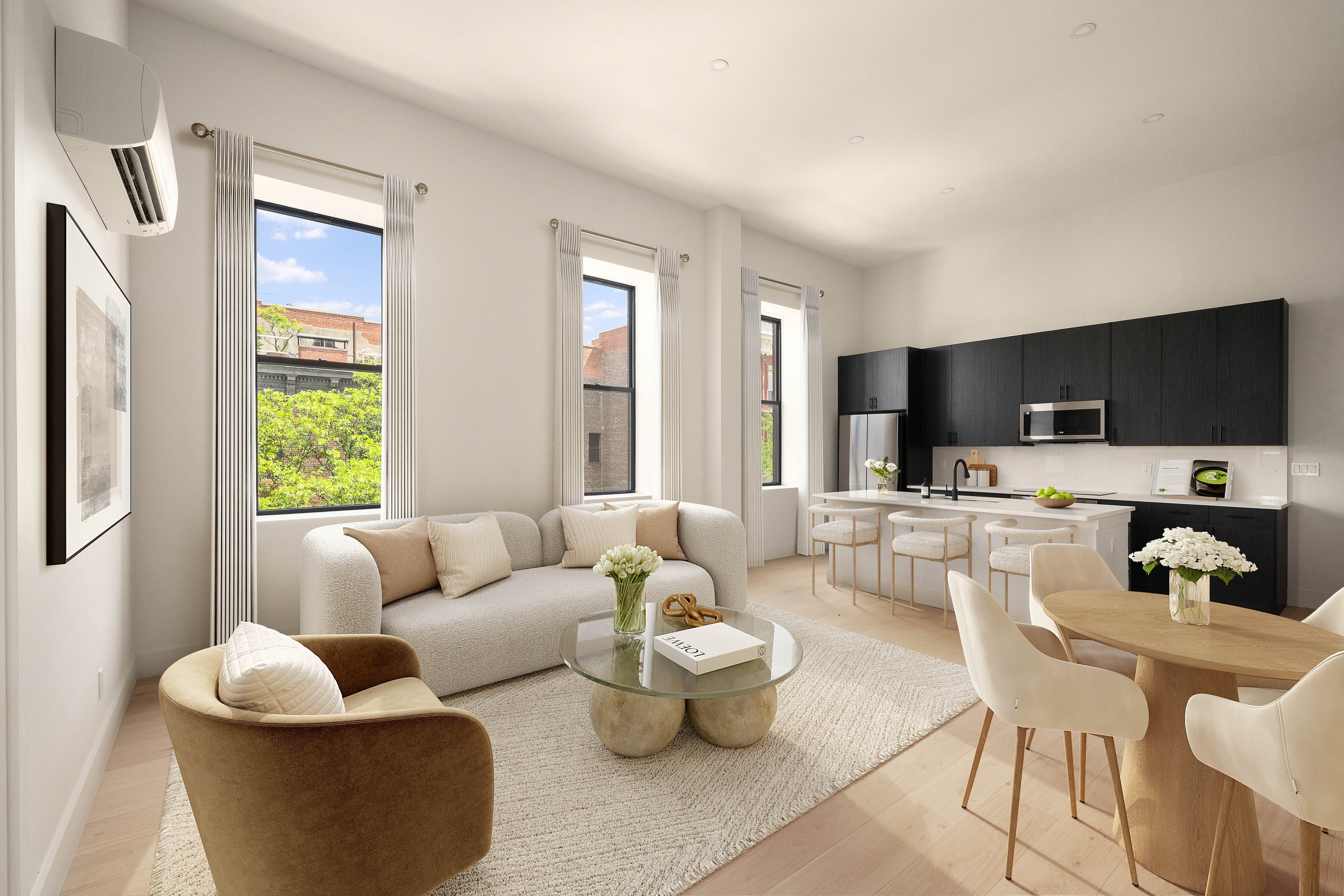 216 Grand Street, Unit LOFT 2 Brooklyn, NY 11211 - Photo 2 of 9 a living room with furniture and a flat screen tv