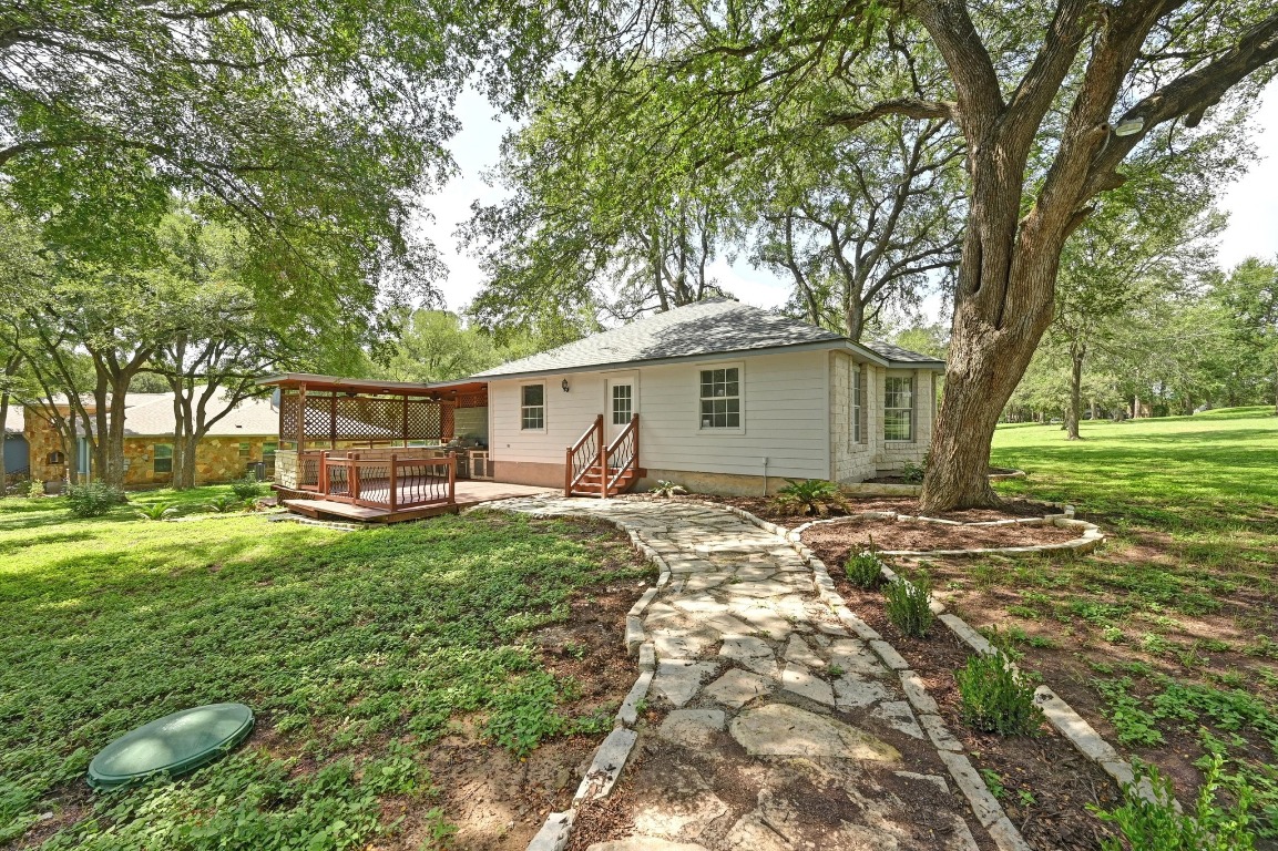 111 Trinity Street Cedar Creek, TX 78612 - Photo 28 of 38 a view of a house with backyard