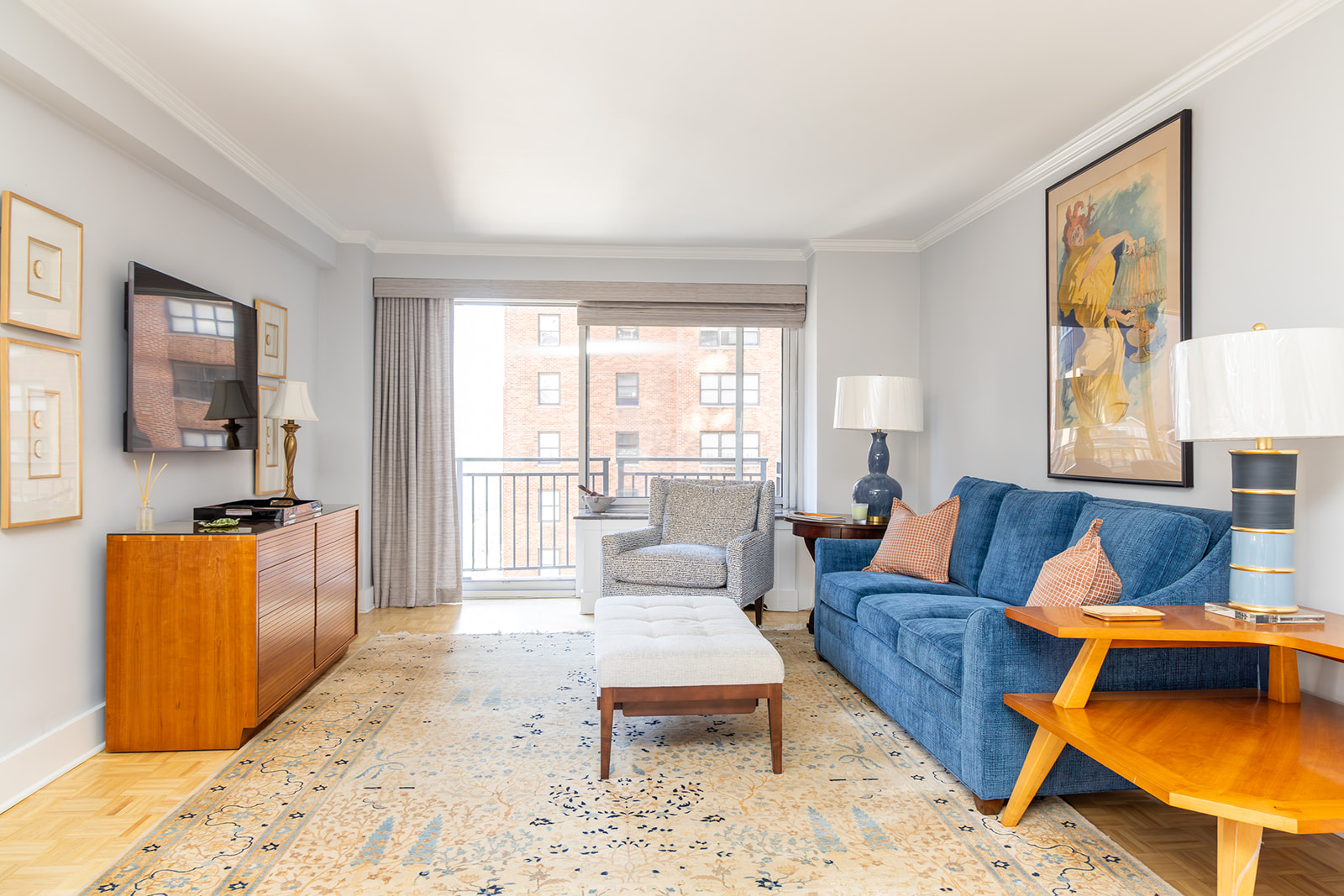 132 East 35th Street, Unit 7H Manhattan, NY 10016 - Photo 2 of 25 a living room with furniture and a flat screen tv