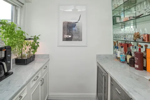 a view of kitchen and sink