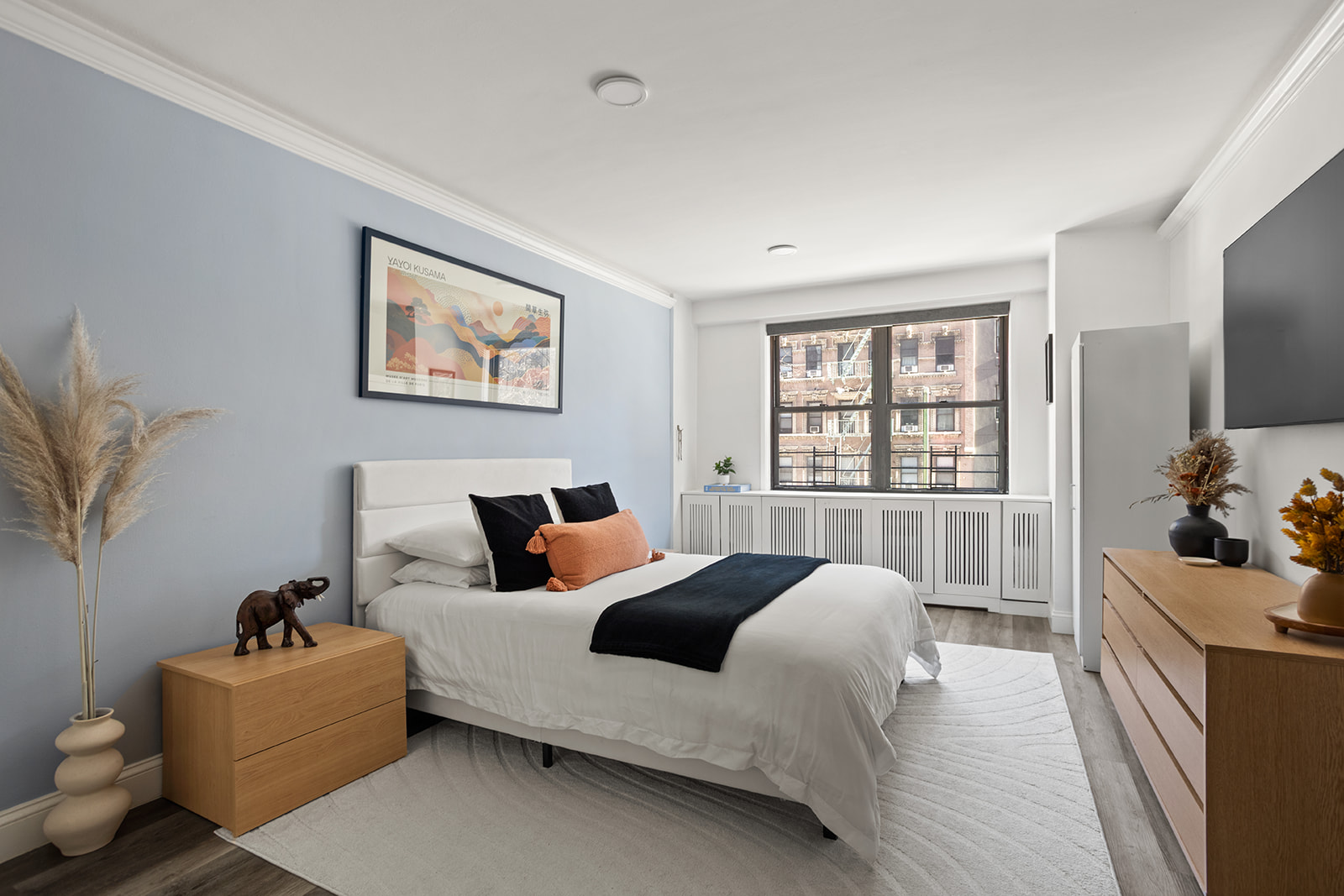 330 3rd Avenue, Unit 3F Manhattan, NY 10010 - Photo 4 of 6 a bedroom with a bed and glass windows