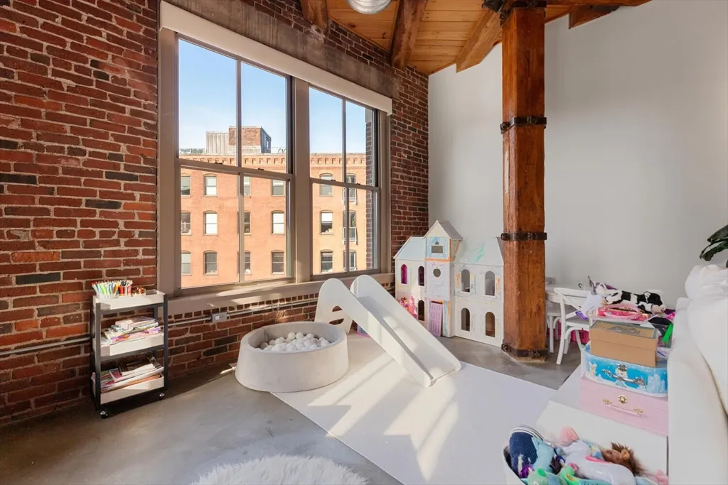 a bedroom with furniture and a window