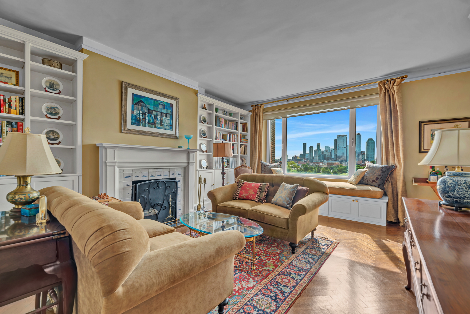 455 East 51st Street, Unit 6B Manhattan, NY 10022 - Photo 3 of 17 a living room with furniture fireplace and a large window