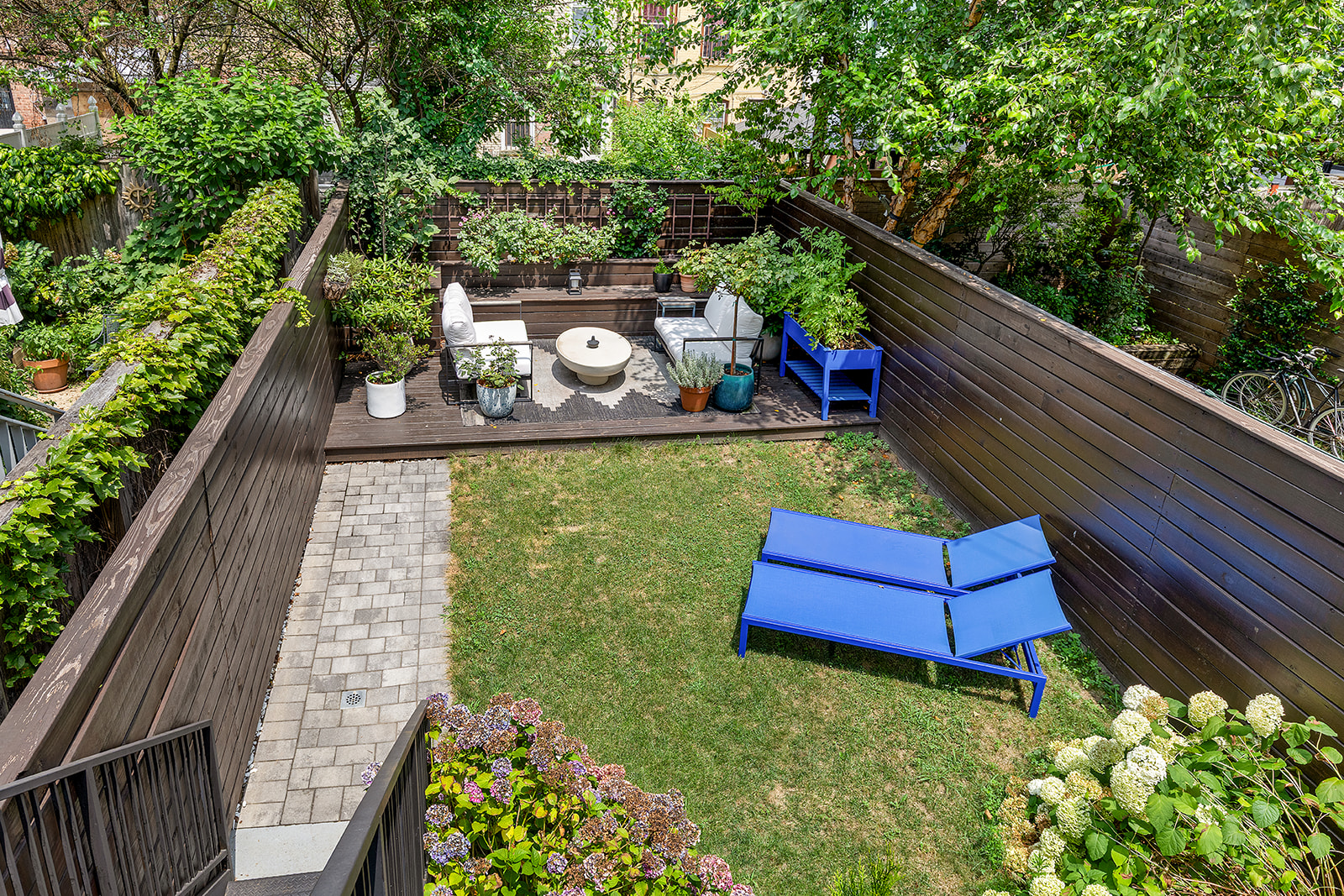 533 Decatur Street Brooklyn, NY 11233 - Photo 19 of 21 a view of a wooden deck with a bench
