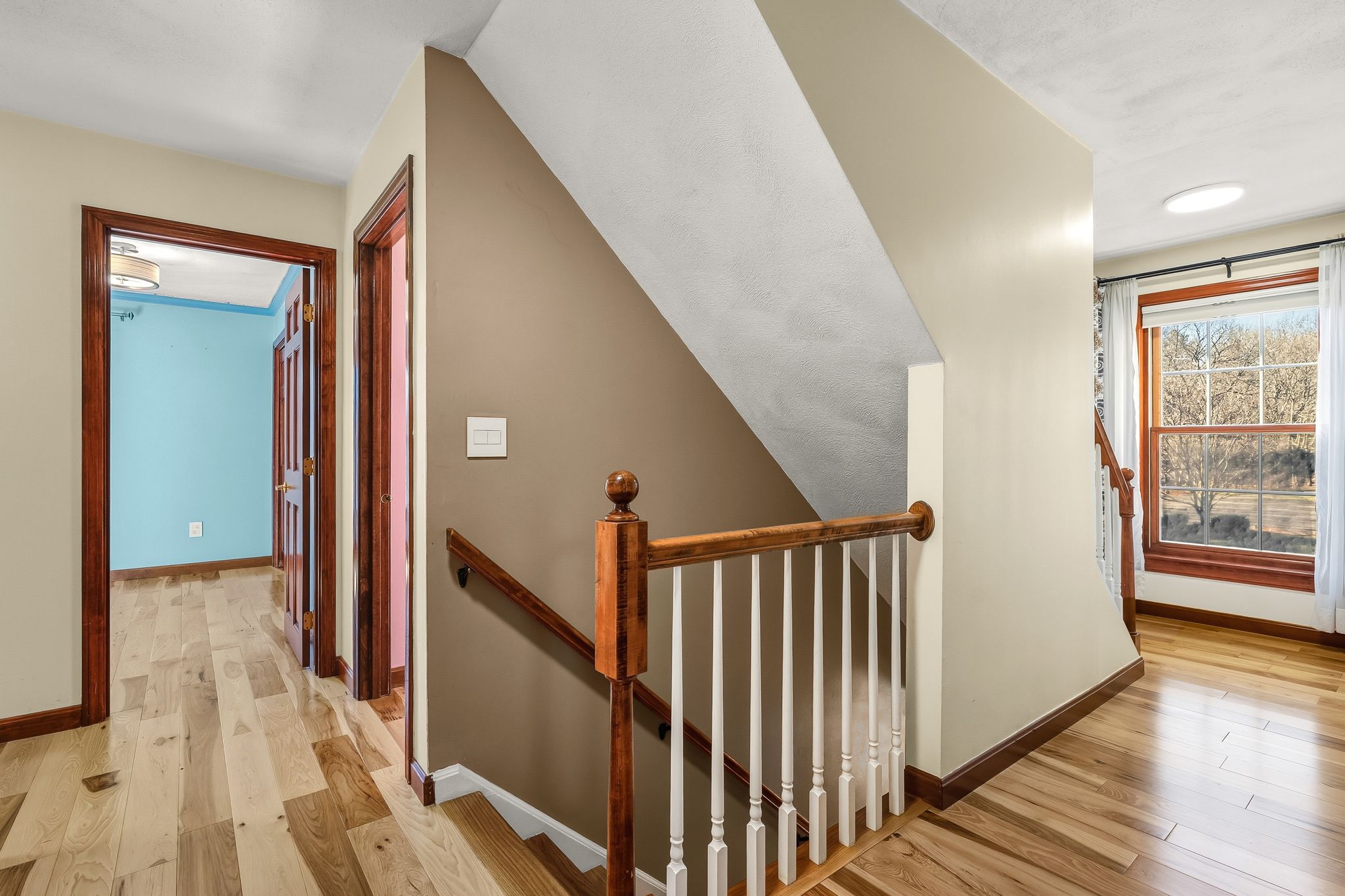 129 H J Albee Drive Braintree, MA 02184 - Photo 13 of 36 a view of a hallway with wooden floor and windows