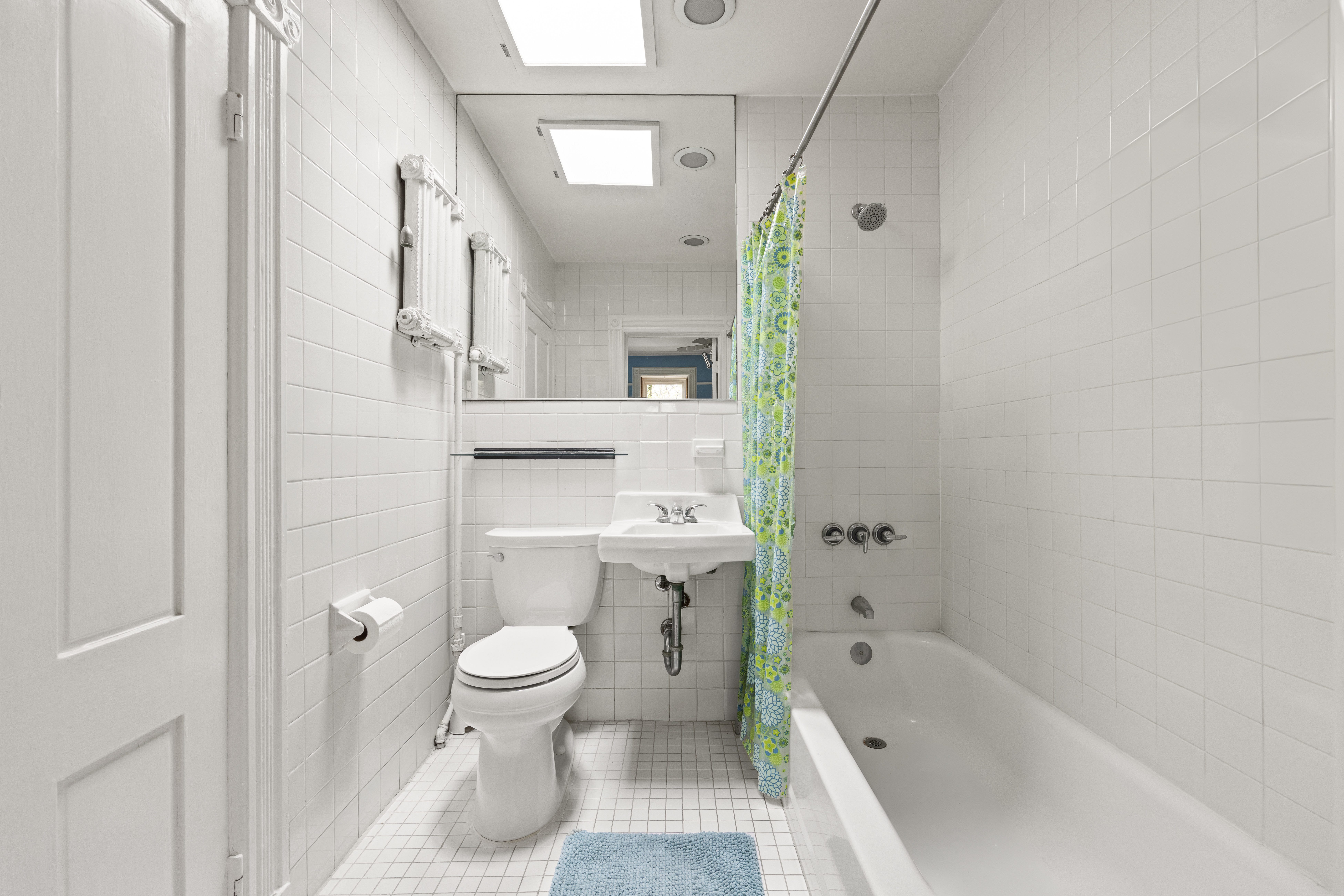482 11th Street Brooklyn, NY 11215 - Photo 21 of 24 a bathroom with a sink a toilet and a bathtub