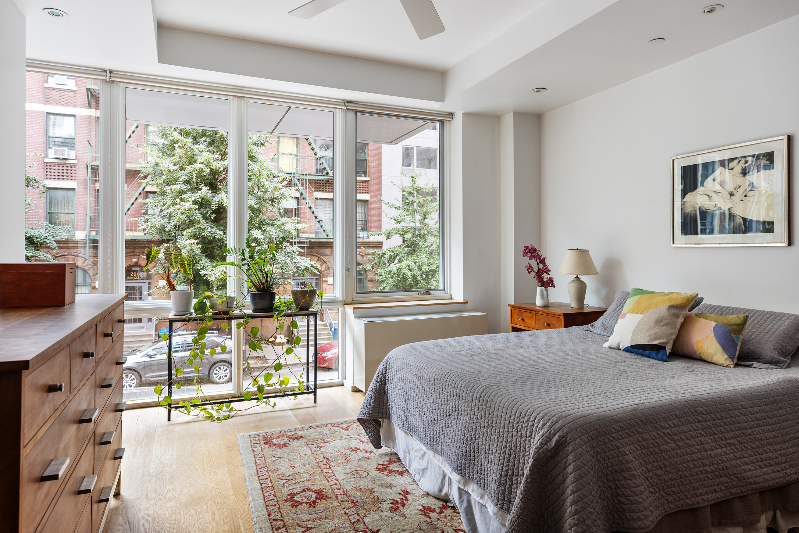271 West 122nd Street, Unit A Manhattan, NY 10027 - Photo 10 of 19 a bedroom with a bed and a large window