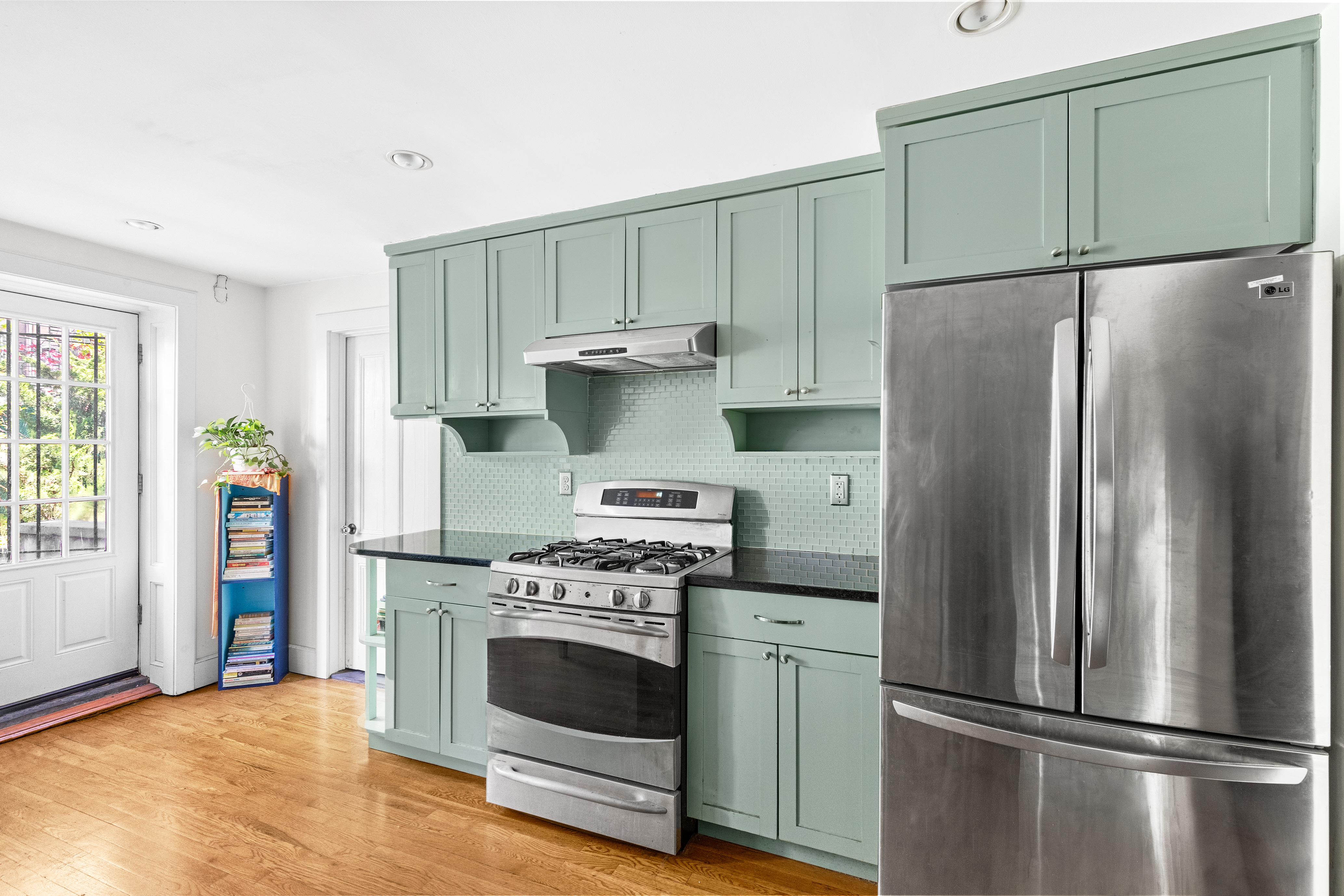 955 Bushwick Avenue Brooklyn, NY 11221 - Photo 9 of 19 a kitchen with a stove refrigerator and a sink