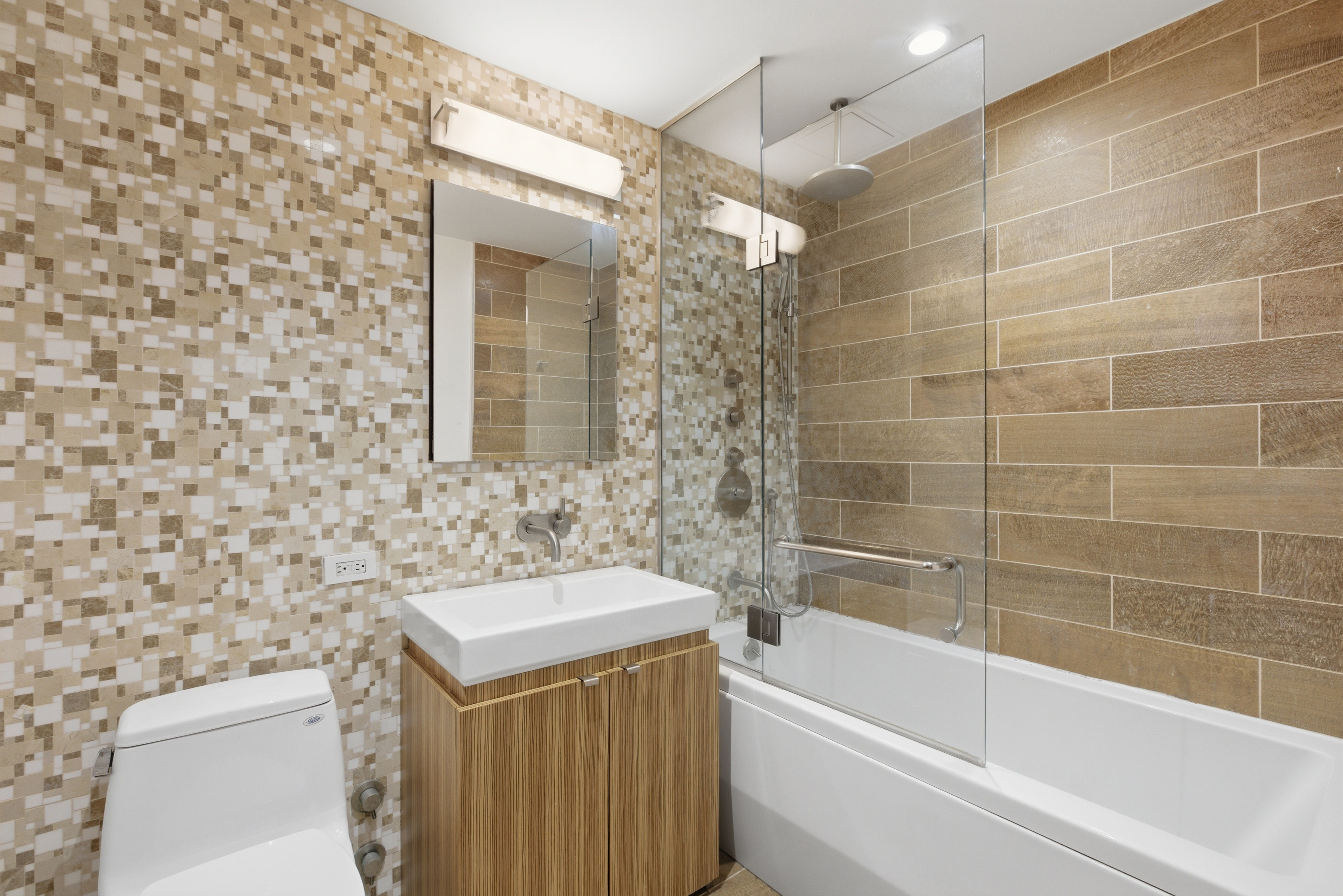 2280 Frederick Douglass Boulevard Manhattan, NY 10027 - Photo 9 of 10 a bathroom with a sink a toilet and bathtub
