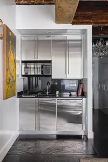 a kitchen with stainless steel appliances granite countertop a sink and cabinets