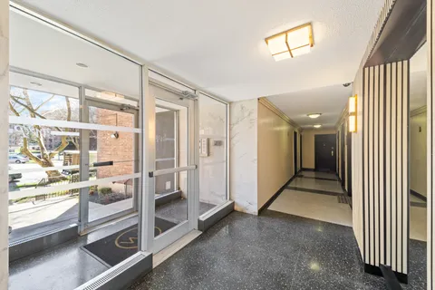 a view of an empty room and a window