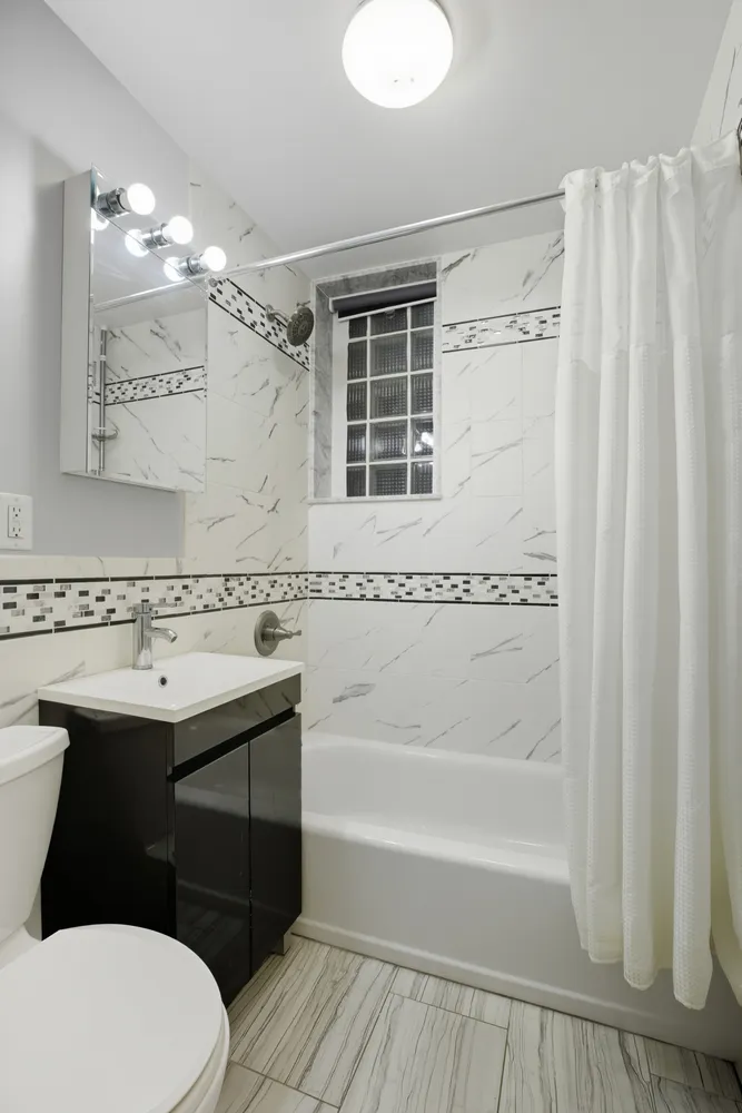 a kitchen with granite countertop a sink and a stove top oven