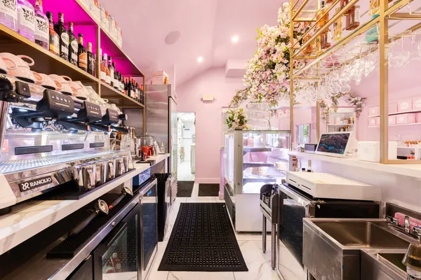 a kitchen with stainless steel appliances a stove a sink and a refrigerator