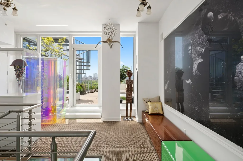 a view of a hallway and a livingroom with furniture