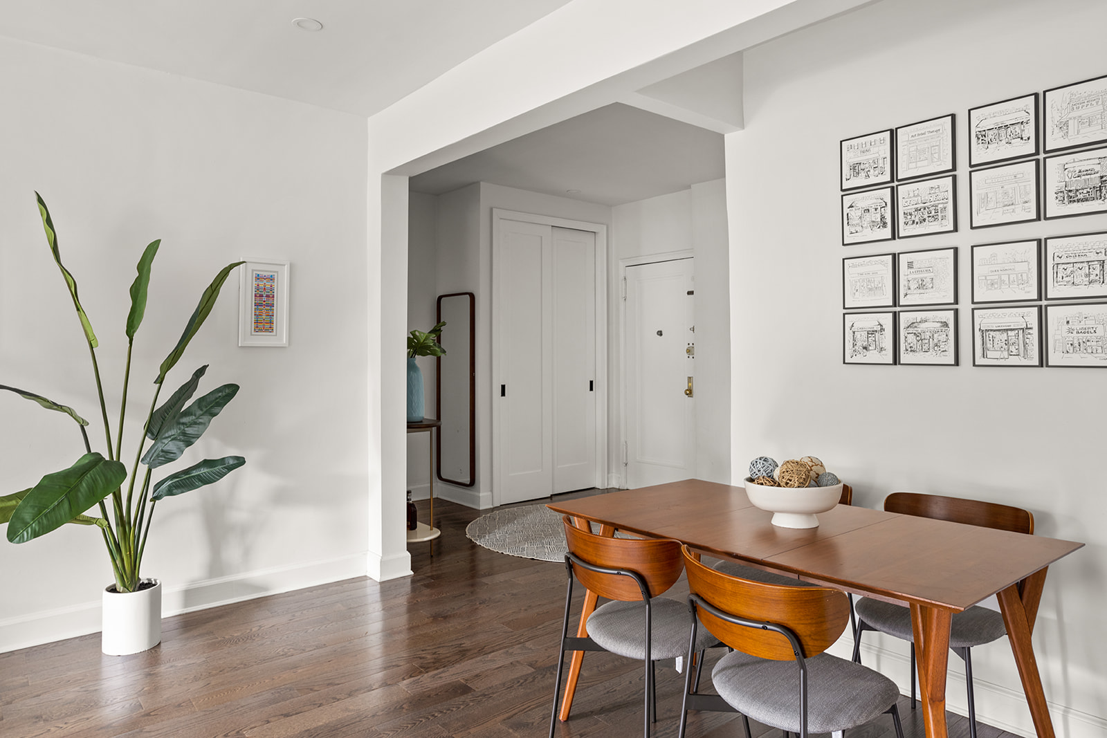 72-17 34th Avenue, Unit 1P Queens, NY 11372 - Photo 4 of 14 a view of a dining room with furniture and wooden floor