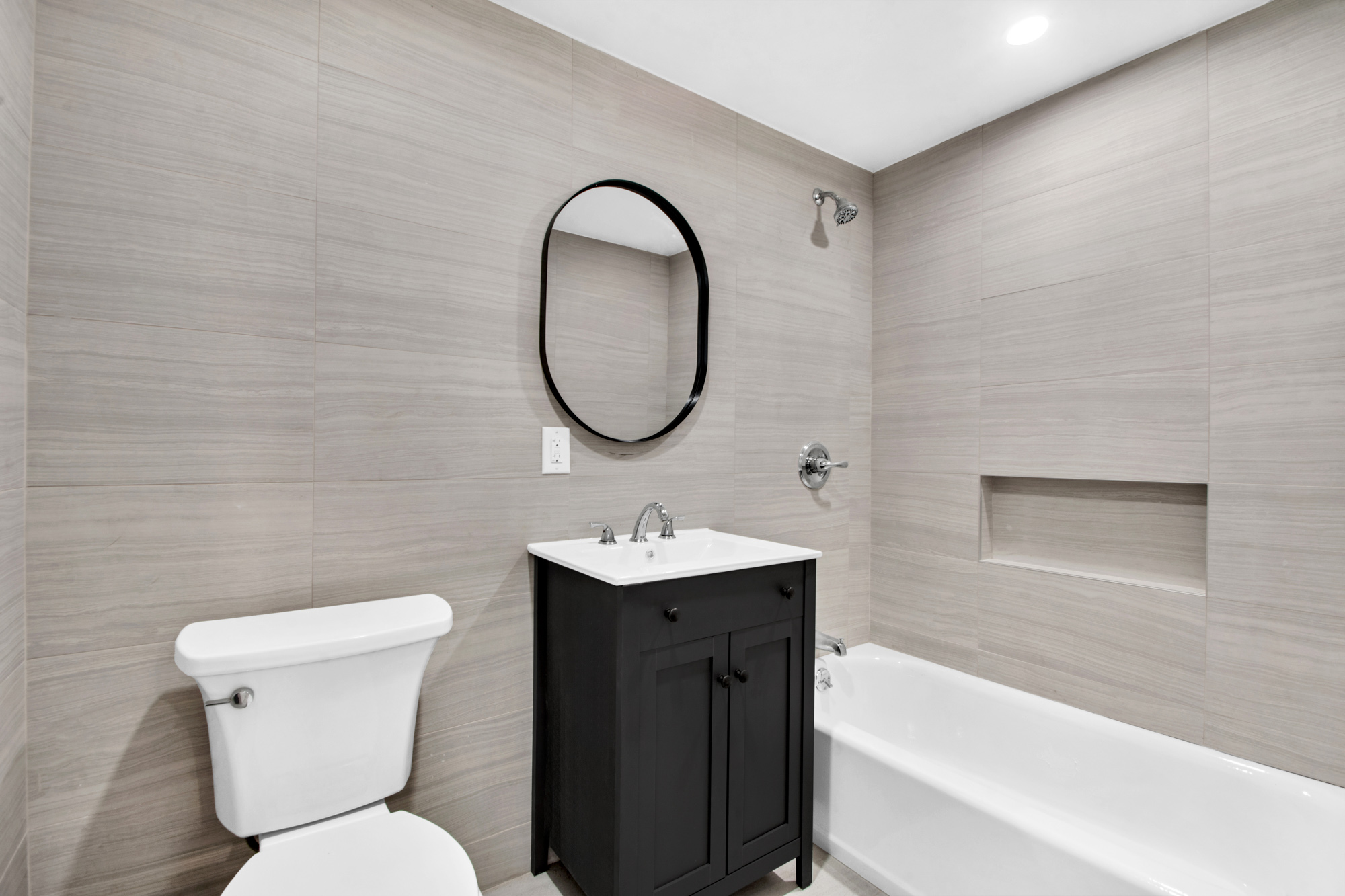 178 30th Street, Unit 1 Brooklyn, NY 11232 - Photo 3 of 6 a bathroom with a sink toilet and a bathtub