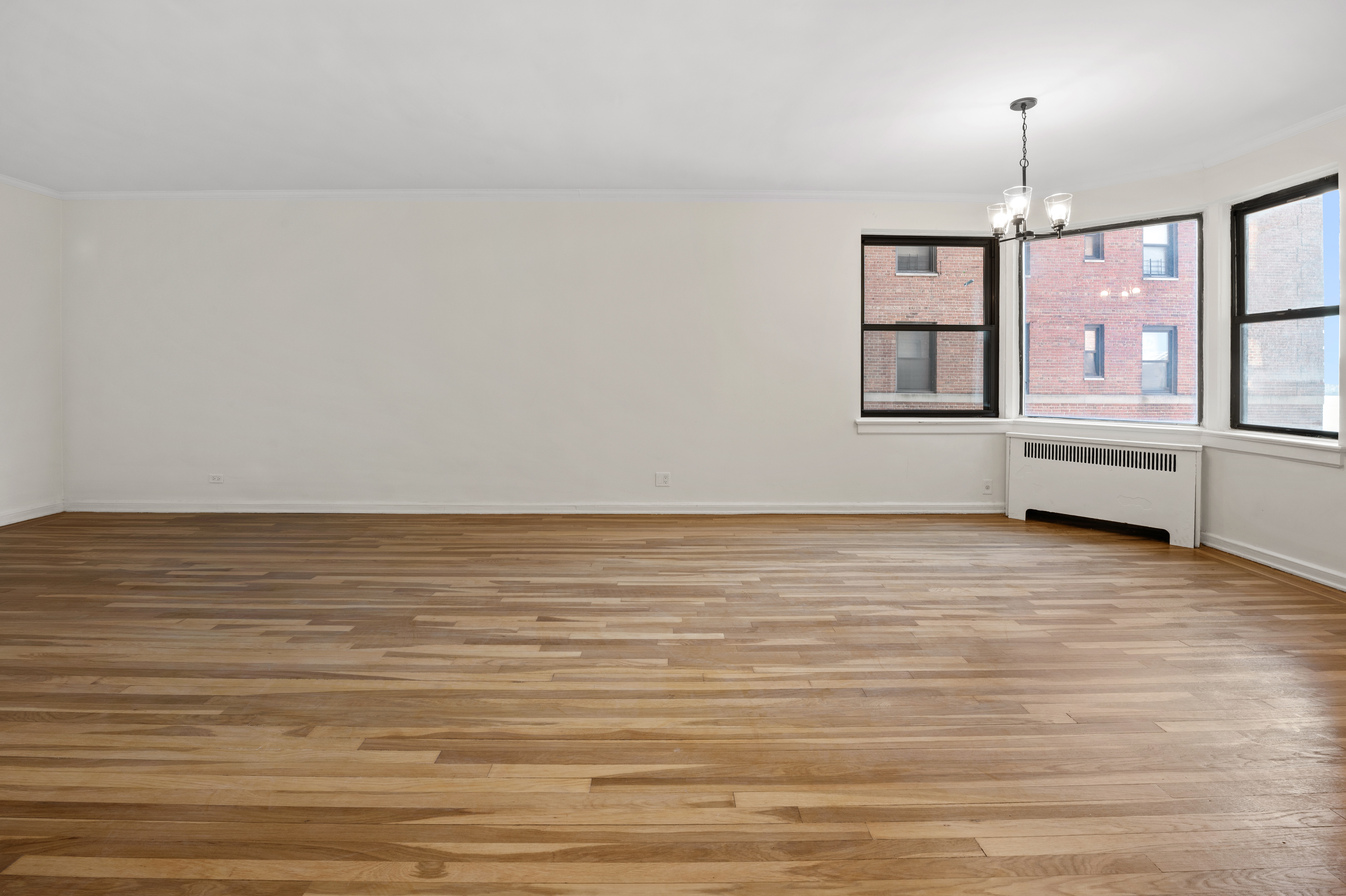159-34 Riverside Drive West, Unit 3D Manhattan, NY 10032 - Photo 3 of 12 a view of an empty room with window