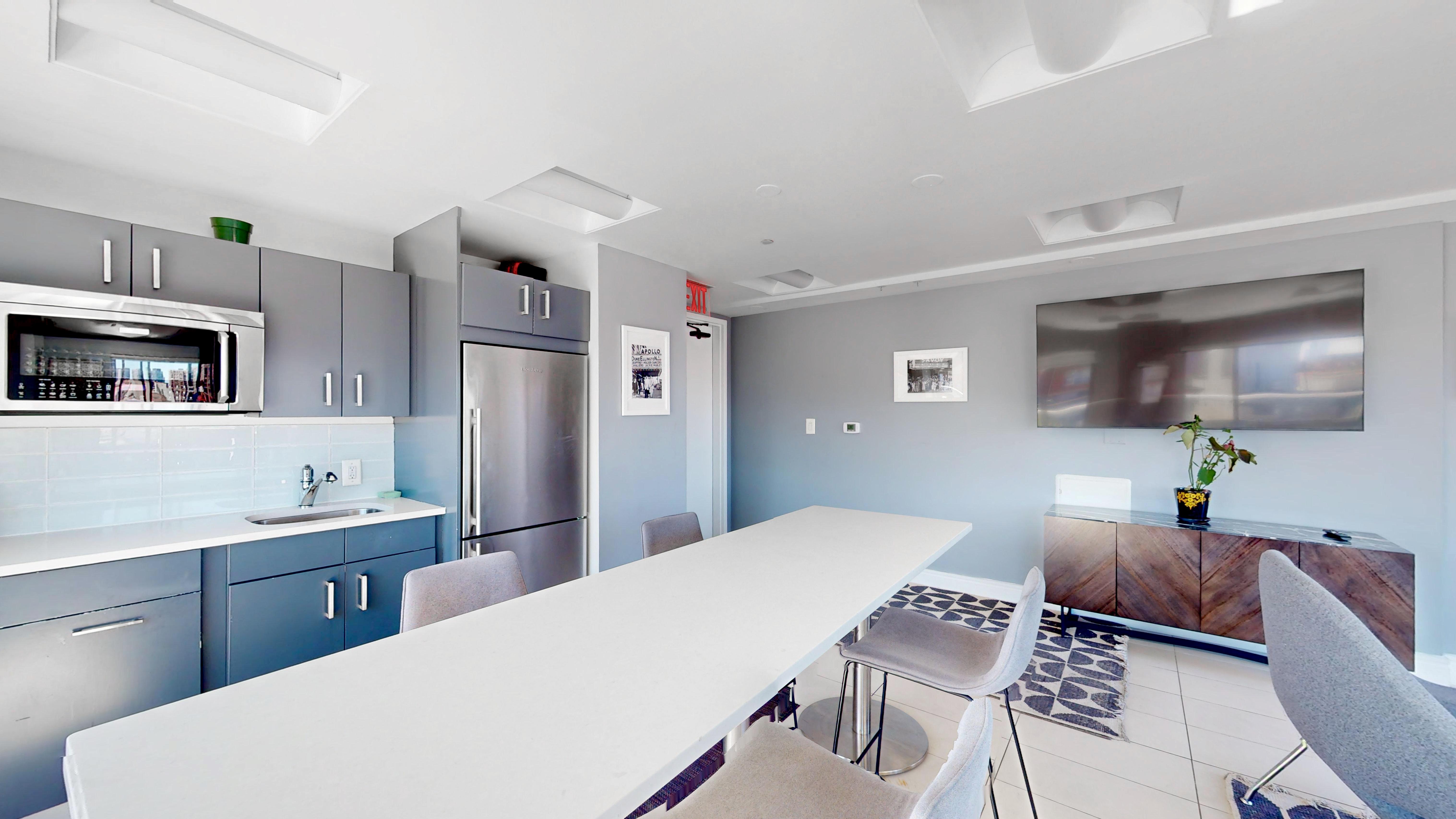 171 West 131st Street, Unit 620 Manhattan, NY 10027 - Photo 13 of 17 a living room with stainless steel appliances kitchen island granite countertop furniture and a kitchen view