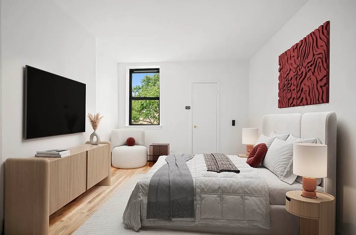 103 West 105th Street, Unit 5A Manhattan, NY 10025 - Photo 6 of 11 a bedroom with a bed and a flat screen tv