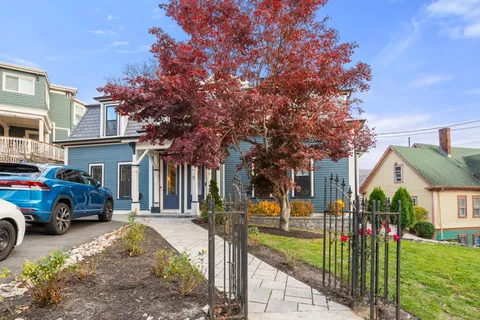 a car parked in front of a house