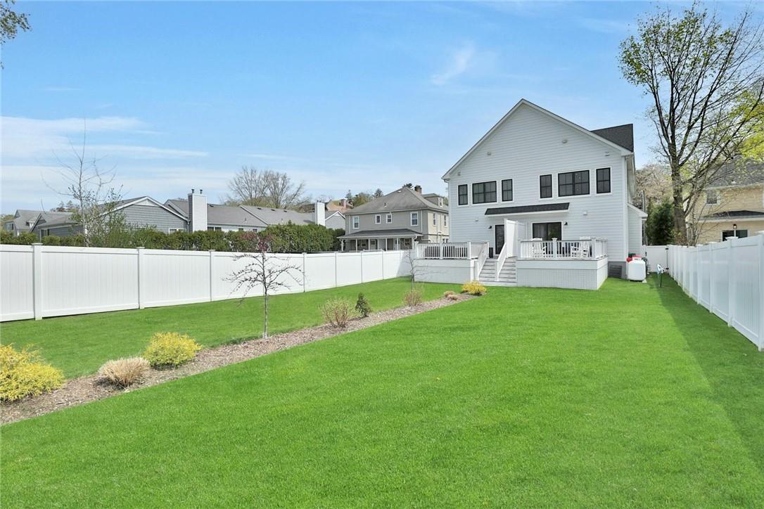 211 Purchase Street, Unit A Rye, NY 10580 - Photo 22 of 22 a view of a house with a yard and sitting area