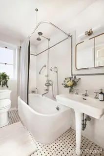 a bathroom with a bathtub and sink