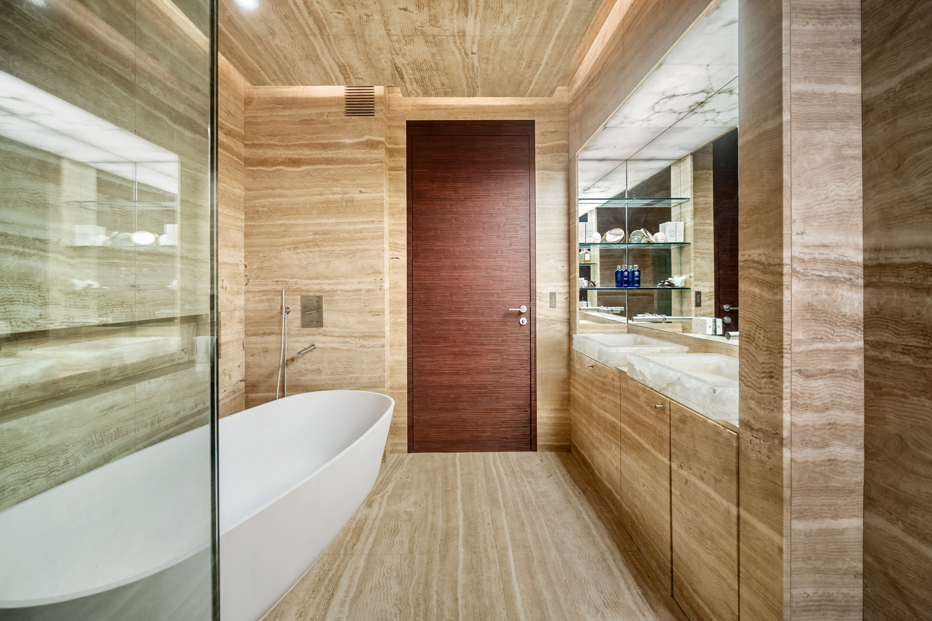 80 Columbus Circle, Unit 67B Manhattan, NY 10019 - Photo 10 of 16 a bathroom with a bathtub and shower