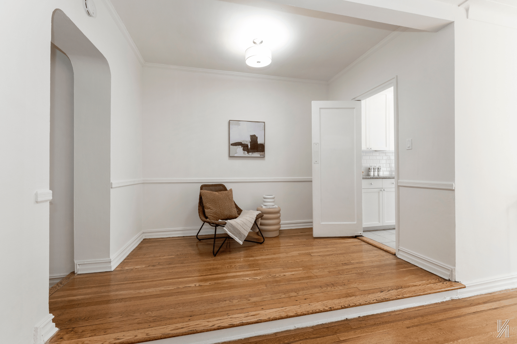 35-35 75th Street, Unit 428 Queens, NY 11372 - Photo 9 of 21 a room with wooden floor and furniture