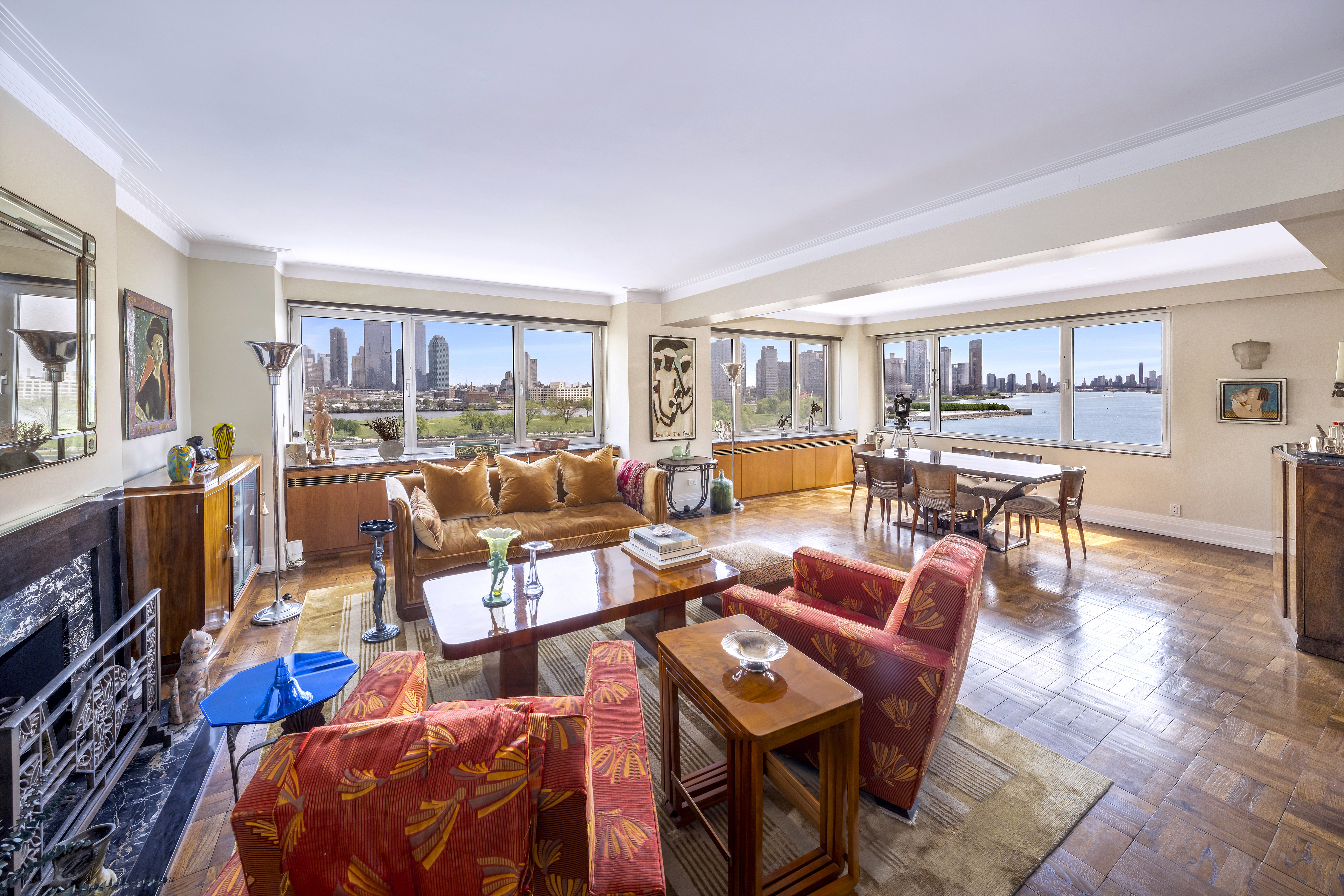 25 Sutton Place South, Unit 8G Manhattan, NY 10022 - Photo 2 of 22 a living room with furniture and a flat screen tv
