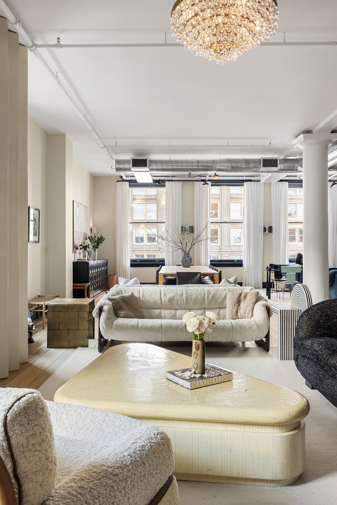 158 Mercer Street, Unit 6B Manhattan, NY 10012 - Photo 4 of 16 a living room with furniture and a large window