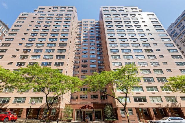 25 Sutton Place South, Unit 16B Manhattan, NY 10022 - Photo 15 of 16 front view of a large building