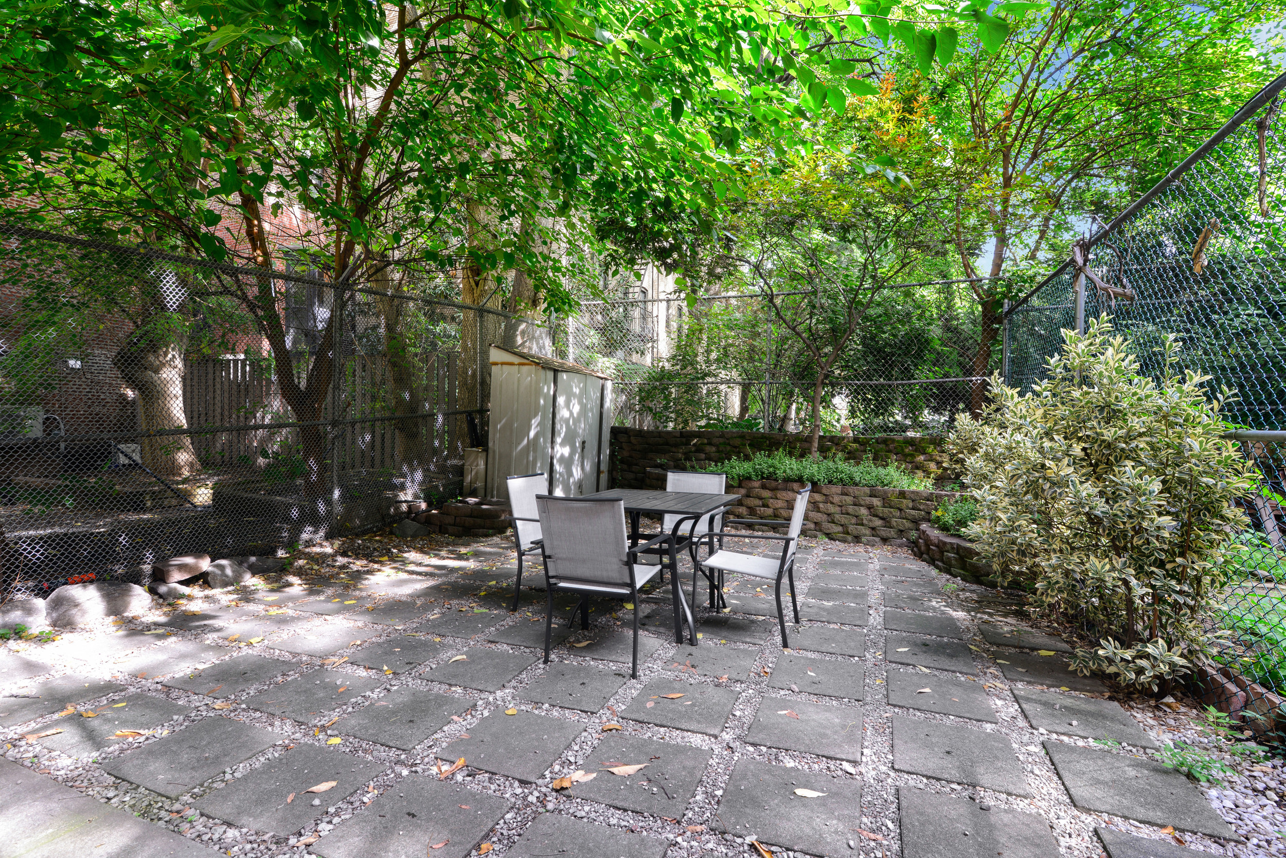 3 East 128th Street, Unit GARDEN Manhattan, NY 10035 - Photo 8 of 10 a view of backyard with outdoor seating and trees